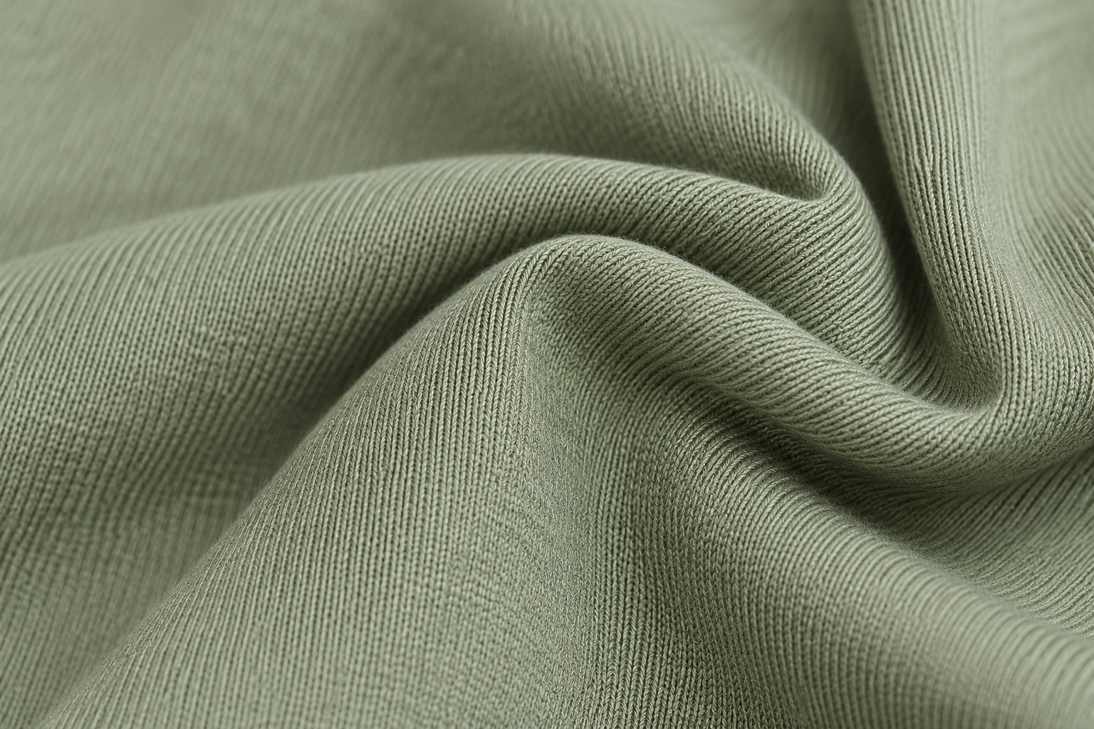 Close-up of soft green bamboo-blend activewear fabric